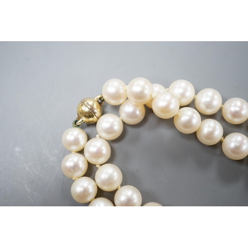 1929 - A single strand cultured pearl necklace, with magnetic ball clasp, 44cm.