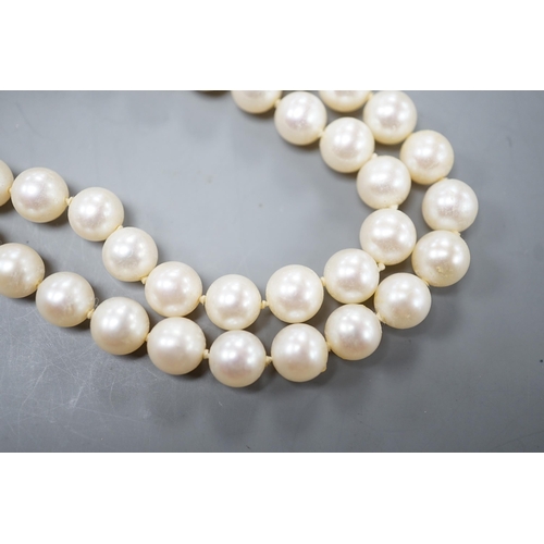 1929 - A single strand cultured pearl necklace, with magnetic ball clasp, 44cm.