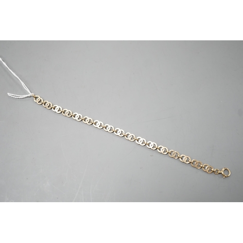 1934 - A modern 9ct gold interwoven circular link bracelet, 17.5cm, 8.3 grams.