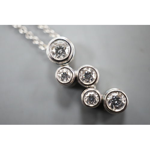 1935 - A modern Tiffany & Co platinum and graduated five stone diamond cluster set pendant necklace, pendan... 