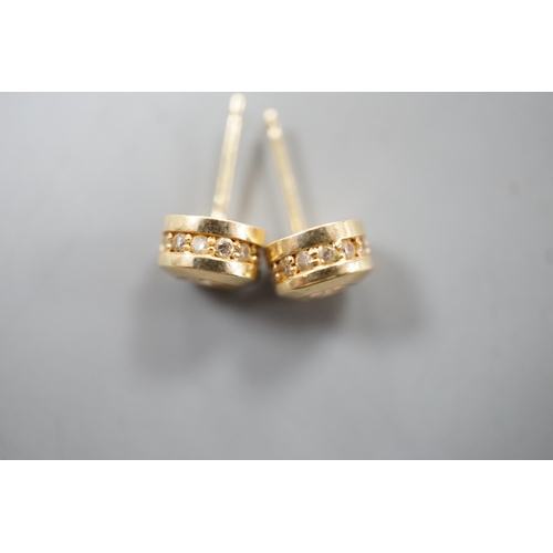 1938 - A modern pair of 14k yellow metal and single stone diamond set ear studs, with diamond chip setting,... 