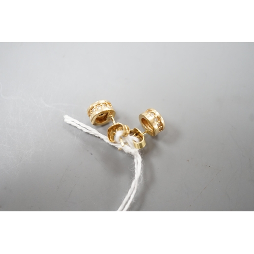 1938 - A modern pair of 14k yellow metal and single stone diamond set ear studs, with diamond chip setting,... 