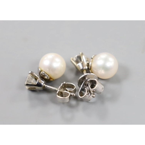 1947 - A pair of white metal cultured pearl and single stone diamond set ear studs (butterflies differ) pea... 