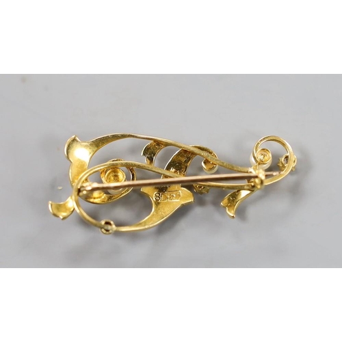 1948 - An 18ct, diamond and graduated seed pearl set scroll brooch, 36mm, gross weight 4 grams.