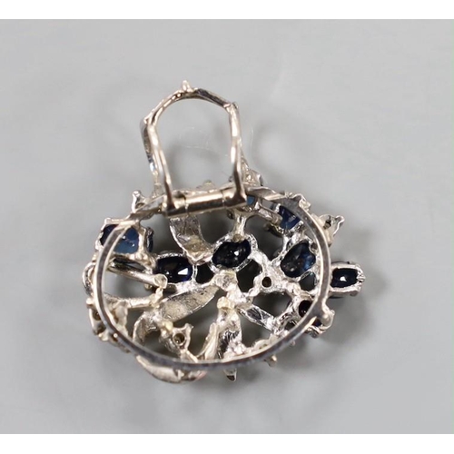 1949 - A yellow and white metal, sapphire and diamond cluster set oval pendant, 20mm, gross weight  3.8 gra... 