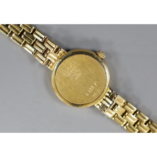 1951 - A lady's 18ct gold Longines quartz wrist watch, with mother of pearl dial and diamond chip set bezel... 