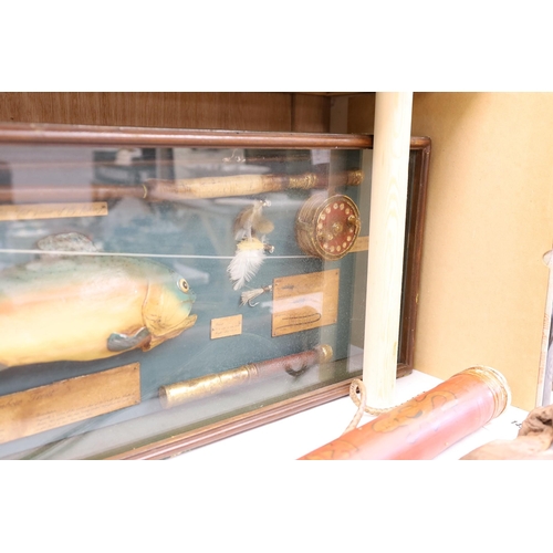 1402 - A cased fishing display case of a Rainbow Trout centred around angling ephemera, 106 x 34cm