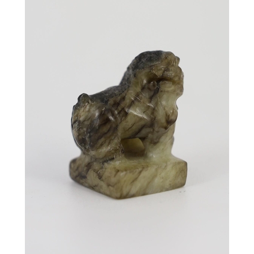 1594 - A Chinese pale celadon and black jade lion-dog seal, 18th/19th century, the creamy white stone wit... 