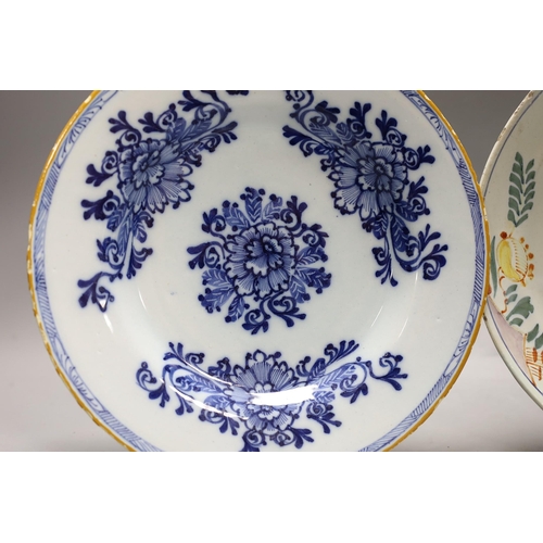 1602 - An early 18th century Delft polychrome dish and a mid 18th century Delft blue and white plate, large... 