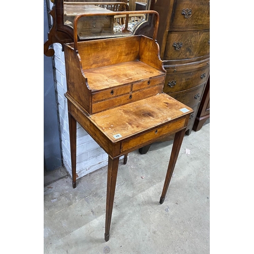 10 - A George III satinwood cheveret or reading table with removeable book carrier, width 48cm, depth 45c... 