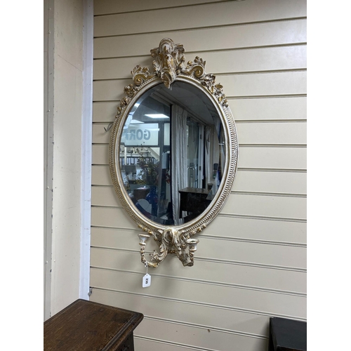 109 - A Victorian style oval girandole wall mirror, width 59cm, height 96cm