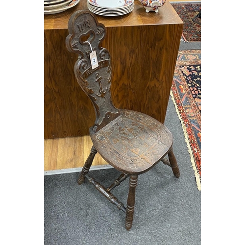 121 - A Victorian carved oak spinning chair, by repute made from the timbers of HMS Foudroyant, dated 1897... 