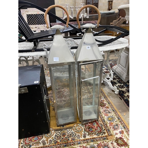 16 - A pair of contemporary square metal and glass lanterns, height 115cm  (one pane broken)