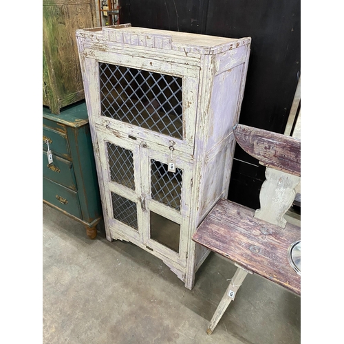 21 - A provincial painted wood side cabinet with leaded glazed doors, width 64cm, depth 36cm, height 127c... 