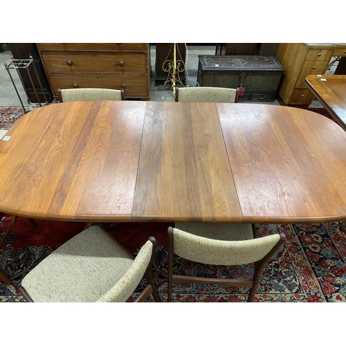 22 - A mid century teak extending dining table, length 214cm extended, one spare leaf, width 108cm, heigh... 