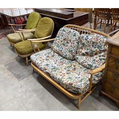 23 - An Ercol light beech three piece lounge suite, settee length 134cm, width 75cm, height 75cm