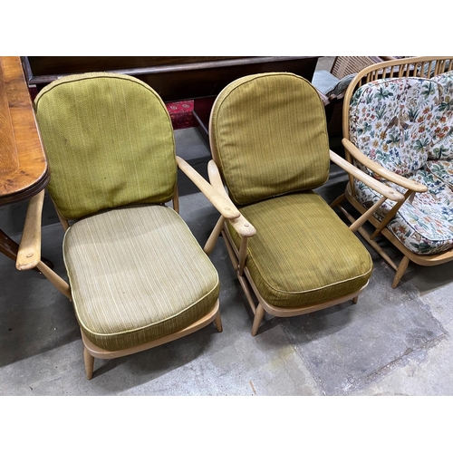 23 - An Ercol light beech three piece lounge suite, settee length 134cm, width 75cm, height 75cm