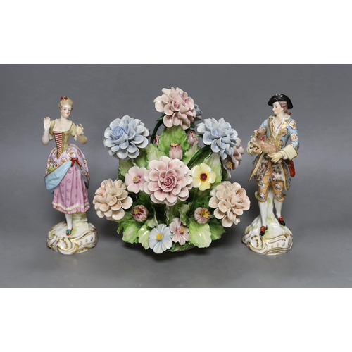 250 - A pair of Continental porcelain figures and a Naples flowers bouquet. 22cm tall