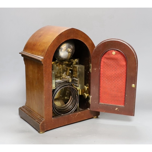 251 - A George V inlaid walnut lancet shaped chiming mantel clock, with German movement and 15th July 1914... 