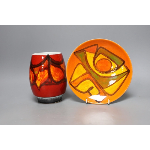 252 - A Poole pottery orange and red abstract vase and plate, 20cm diameter