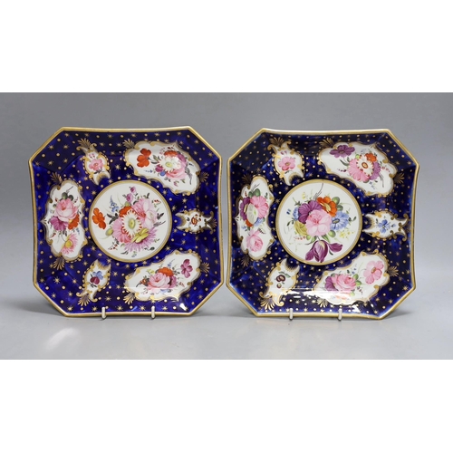 257 - A pair of Coalport ground blue and gilt porcelain square dishes, c.1815-20, with floral panelled dec... 