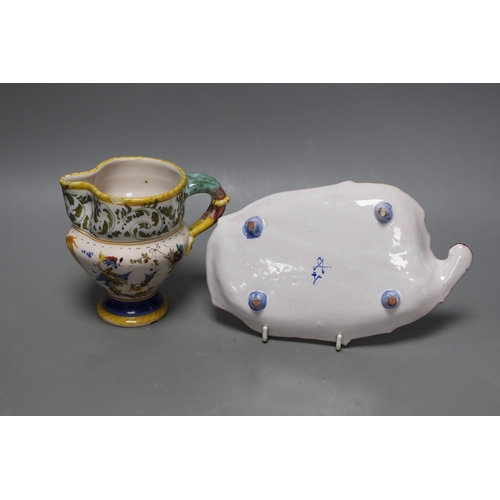 262 - An Italian maiolica pinched beak jug, 12cm tall, and a similar dish