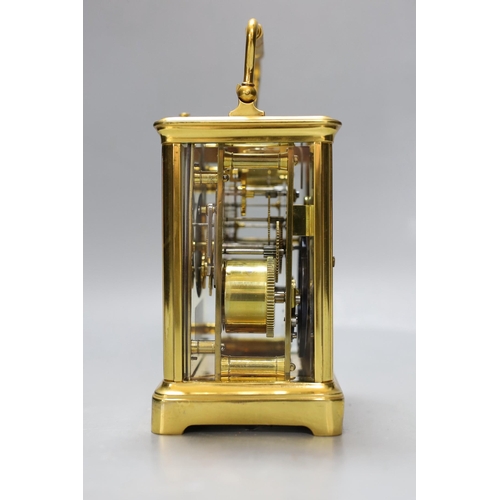 264 - A French brass repeating carriage clock. 18cm tall