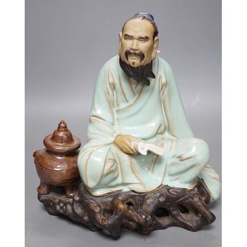 265 - A Chinese Shiwan pottery figure. 23cm tall