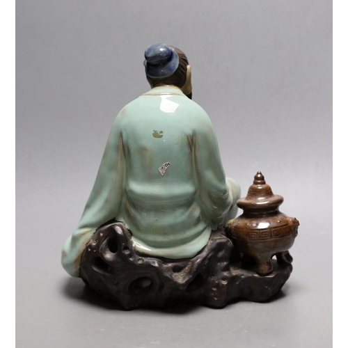 265 - A Chinese Shiwan pottery figure. 23cm tall