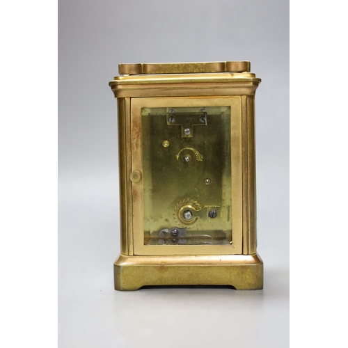 266 - A leather cased brass carriage timepiece. 13cm tall