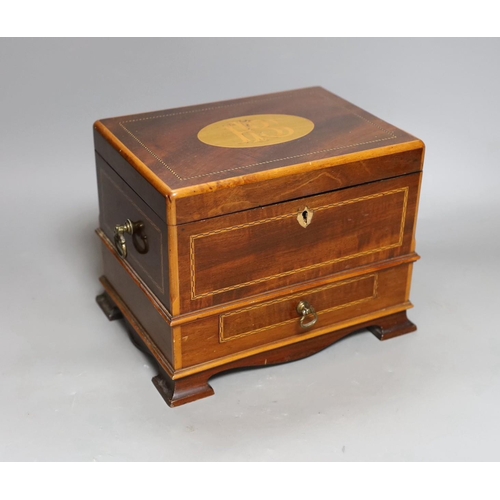 268 - A mahogany jewellery casket with inlaid decoration. 16cm tall