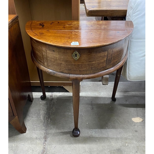 27 - A mid 18th century feather banded mahogany D shaped hinged top side table, width 76cm, depth 46cm, h... 