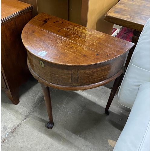 27 - A mid 18th century feather banded mahogany D shaped hinged top side table, width 76cm, depth 46cm, h... 