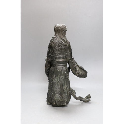 271 - A heavily cast Japanese bronze figure of a bearded man with flowing robes, Meiji period, 31cm tall... 