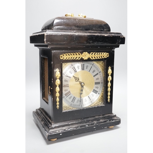 272 - An ebonised bracket clock, 40cm