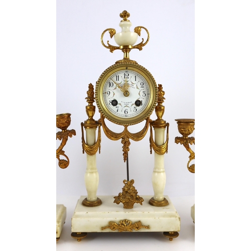 275 - A Louis XVI style ormolu mounted white marble eight day mantel clock and a matching pair of twin bra... 