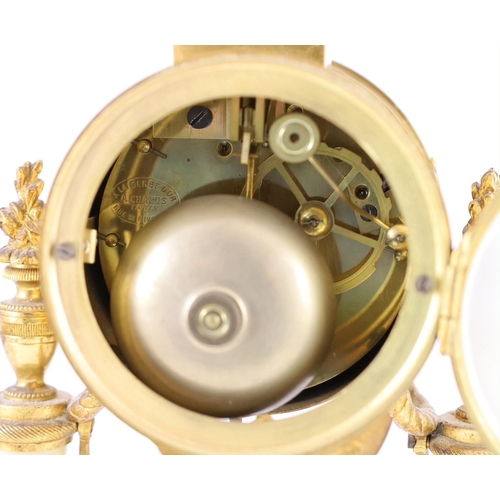 275 - A Louis XVI style ormolu mounted white marble eight day mantel clock and a matching pair of twin bra... 