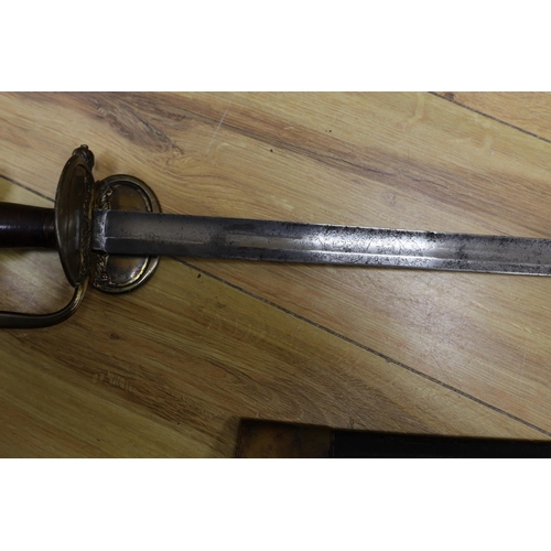 277 - An 18th century European brass hilted sword and scabbard. 89cm long