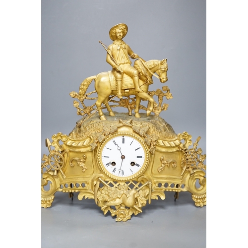 285 - A Louis XV style gilt metal cased eight day mantel clock, 37cm tall