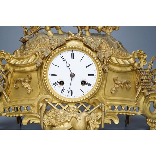 285 - A Louis XV style gilt metal cased eight day mantel clock, 37cm tall