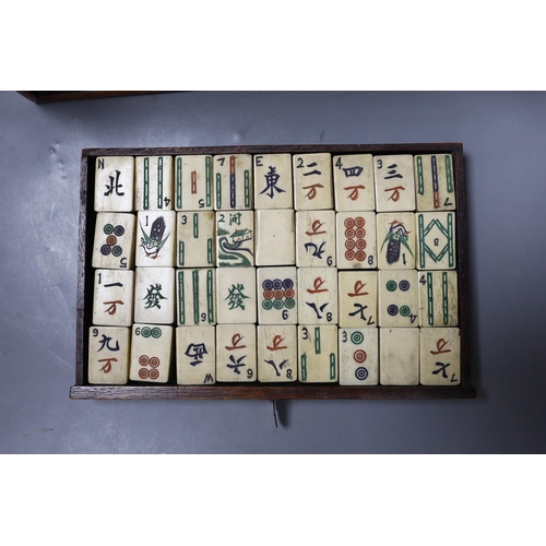 287 - An early 20th century Chinese hardwood cased bone and bamboo mahjong set