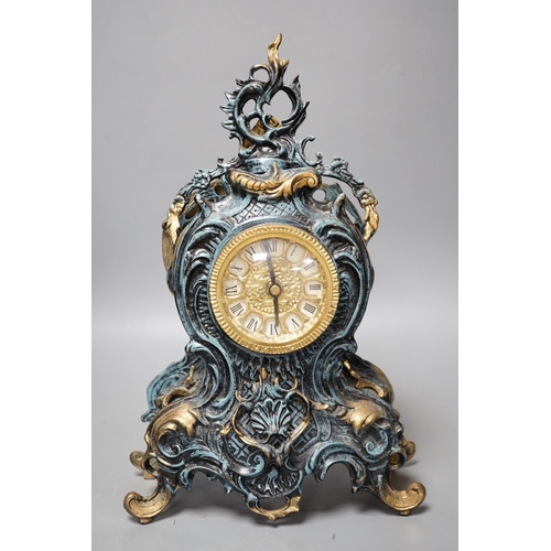 295 - A Louis XV style spelter and parcel gilt mantel timepiece, 37cm