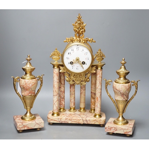 299 - A French gilt metal and marble clock garniture, 38cm