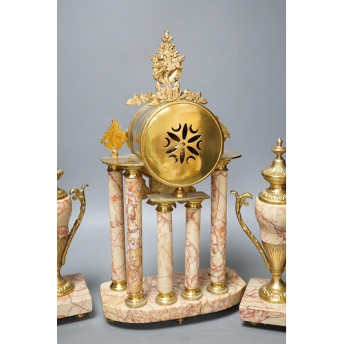 299 - A French gilt metal and marble clock garniture, 38cm