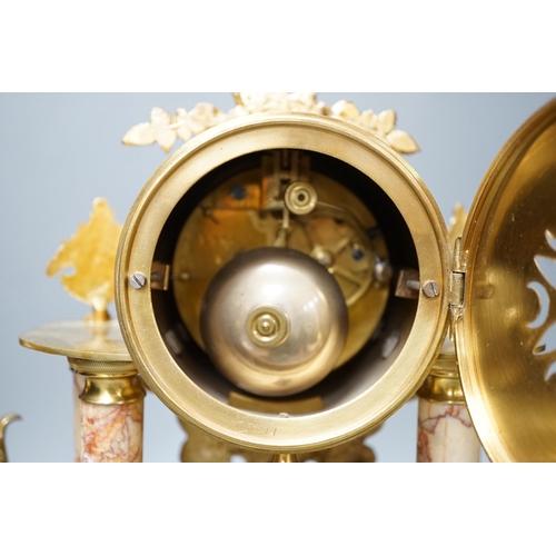 299 - A French gilt metal and marble clock garniture, 38cm