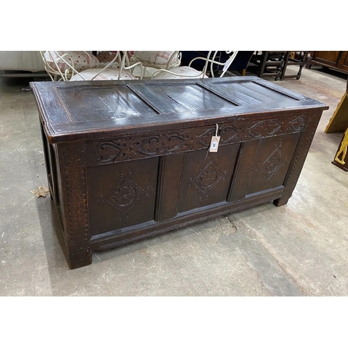 30 - An 18th century carved oak coffer, length 134cm, depth 58cm, height 65cm