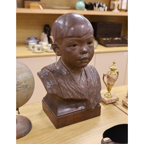 301 - George Henry Paulin (1888-1962), a carved walnut bust of a young Japanese boy,  48cm tall