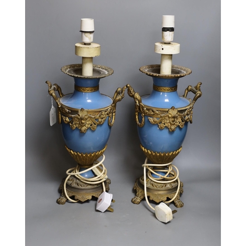 304 - A pair of Sevres -style porcelain ormolu mounted table lamps. 50cm tall