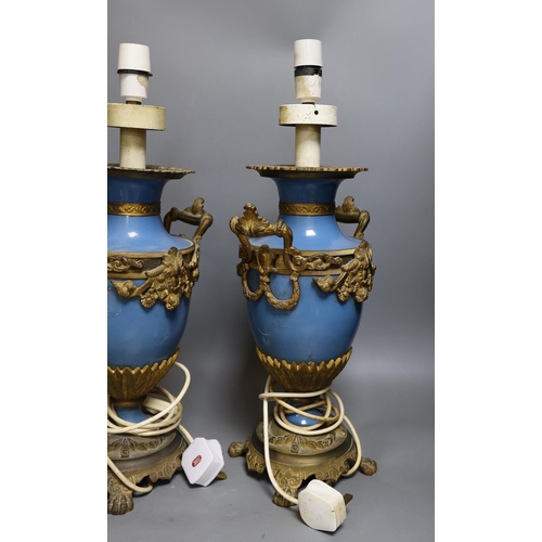 304 - A pair of Sevres -style porcelain ormolu mounted table lamps. 50cm tall