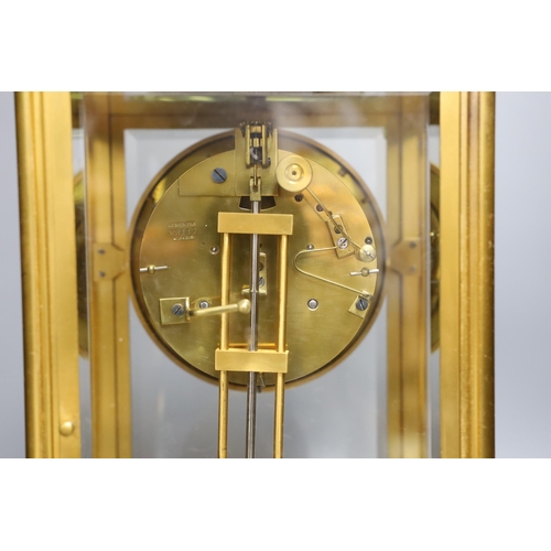 305 - A large gilt framed four glass mantel clock by Le Roy & Fils of London. 36cm tall